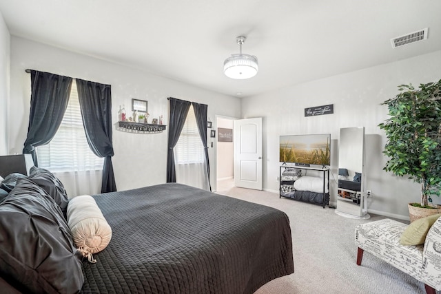 bedroom with light carpet