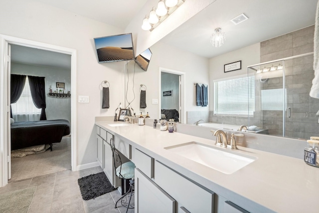 bathroom with vanity, tile patterned floors, an enclosed shower, and a healthy amount of sunlight