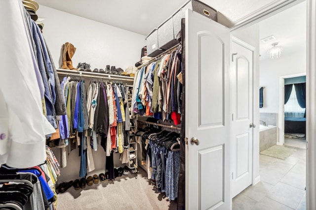 walk in closet featuring light tile patterned floors