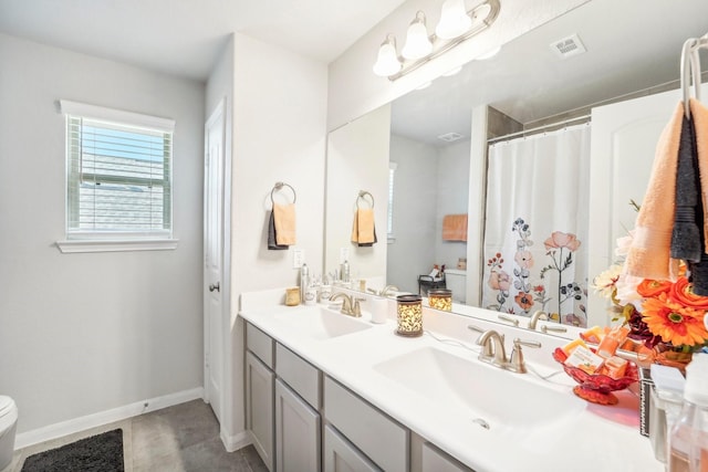 bathroom with tile patterned floors, vanity, toilet, and a shower with shower curtain