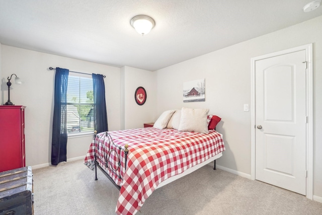 bedroom featuring light colored carpet