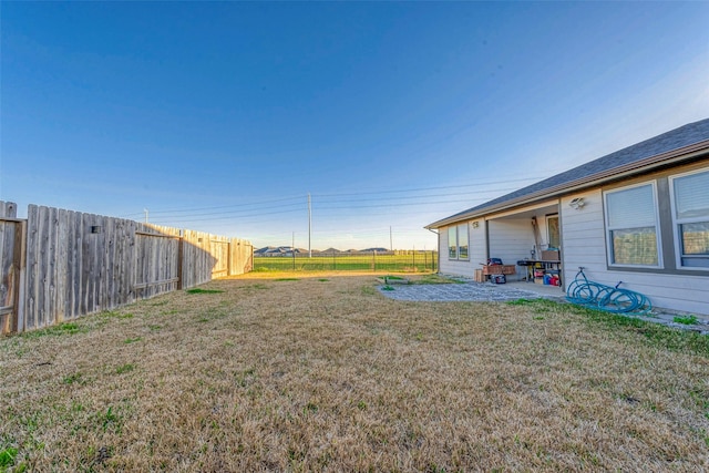 view of yard with a patio and a fenced backyard