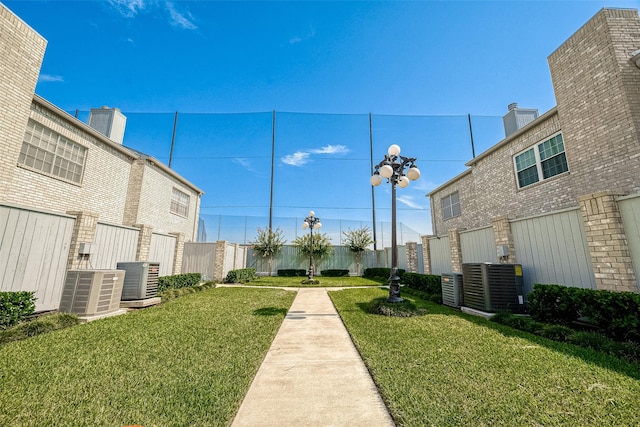 view of property's community featuring a lawn