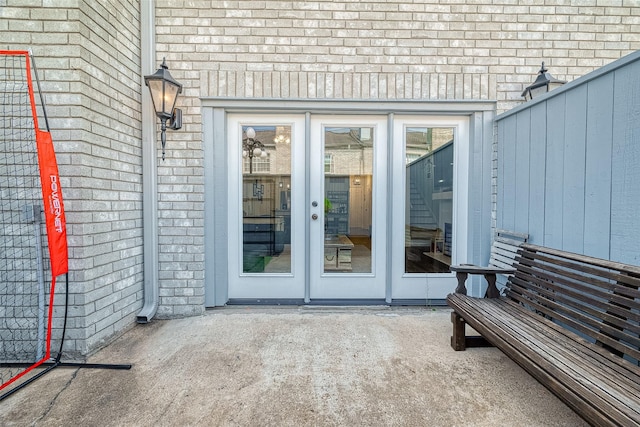 property entrance featuring a patio area