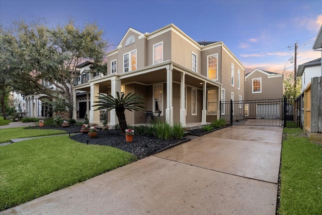 view of front of home featuring a lawn and a porch