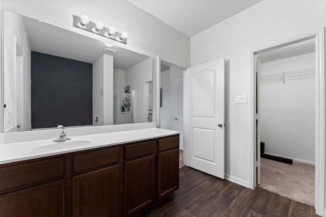 bathroom featuring hardwood / wood-style floors and vanity