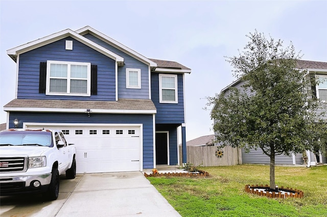 view of front of property featuring a front yard and a garage