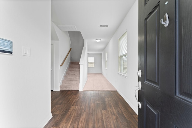 entrance foyer with dark hardwood / wood-style floors