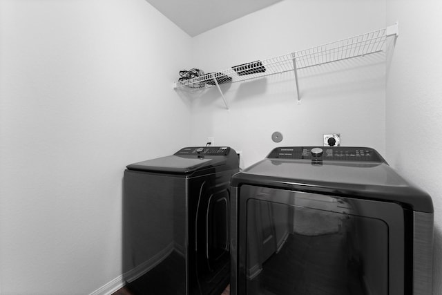 laundry room with washer and clothes dryer