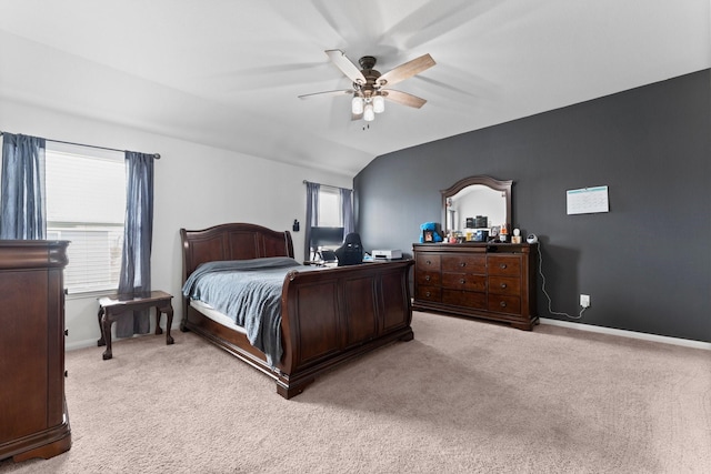 carpeted bedroom featuring multiple windows, ceiling fan, and vaulted ceiling