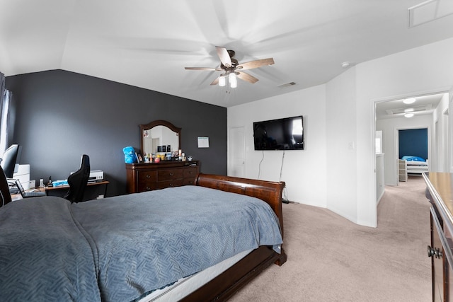 bedroom featuring ceiling fan, light carpet, and vaulted ceiling