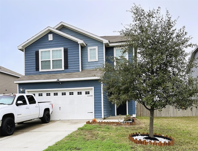 view of front facade with a garage and a front lawn