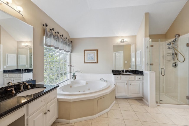 bathroom with tile patterned floors, plus walk in shower, vanity, and lofted ceiling