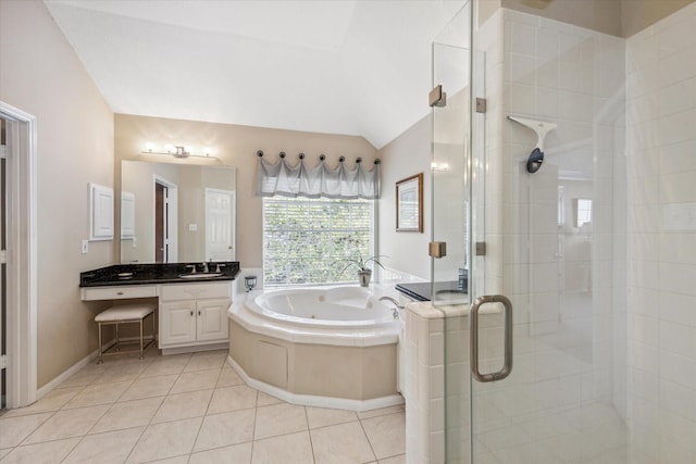 bathroom featuring tile patterned flooring, vanity, independent shower and bath, and vaulted ceiling