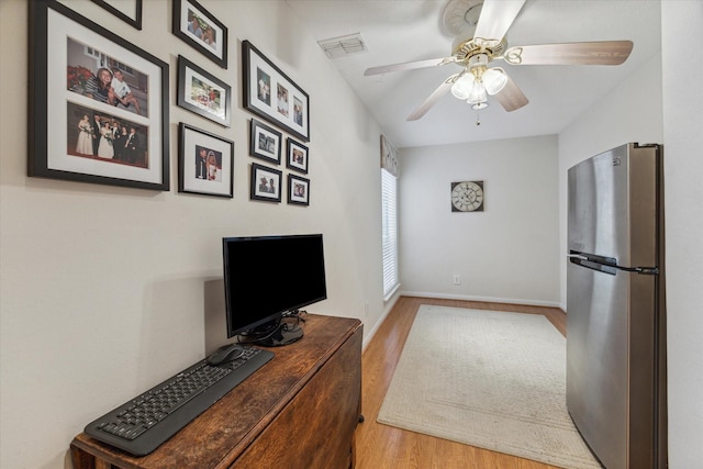 interior space featuring hardwood / wood-style floors and ceiling fan