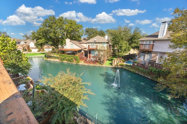 view of pool with a water view