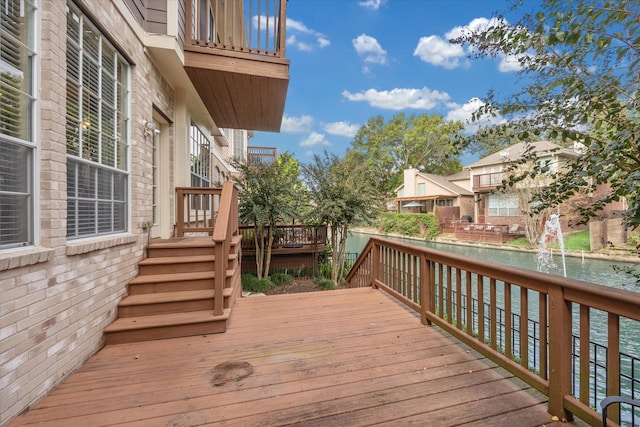 wooden deck with a water view