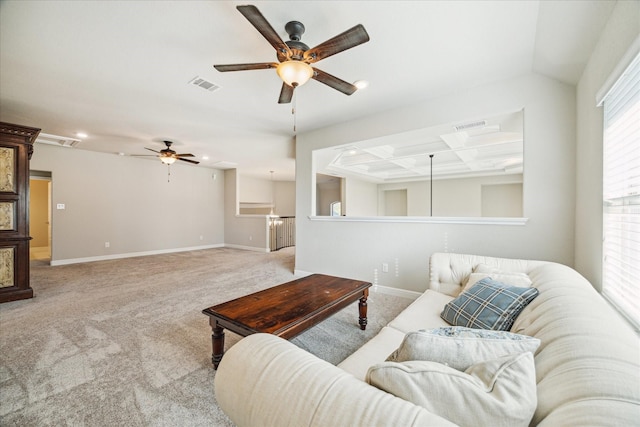 carpeted living room with ceiling fan and coffered ceiling