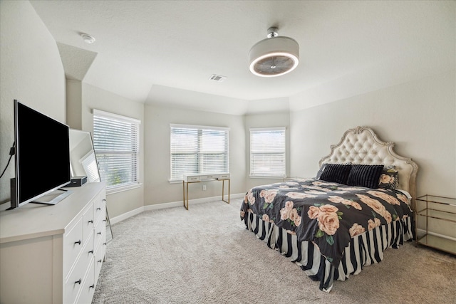 bedroom featuring light colored carpet