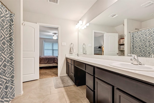 bathroom featuring tile patterned flooring, vanity, and ceiling fan