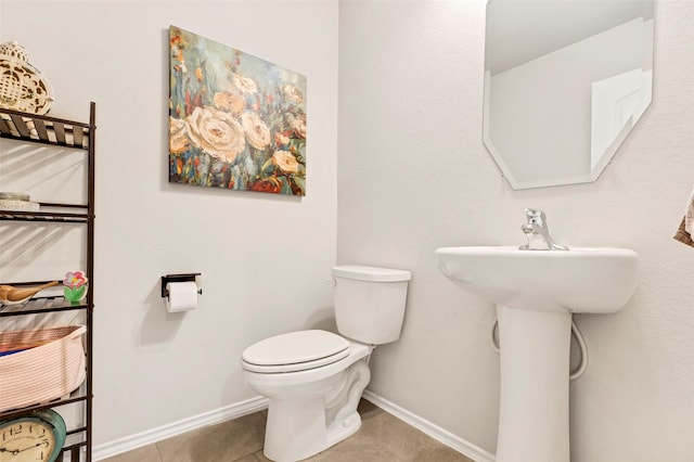 bathroom featuring tile patterned floors and toilet