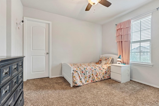 carpeted bedroom featuring ceiling fan