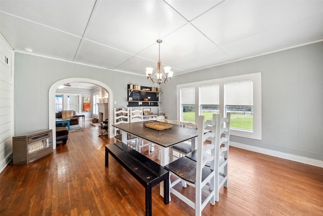 dining space featuring a chandelier and wood-type flooring