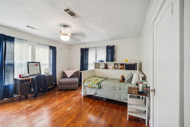 bedroom with ceiling fan and hardwood / wood-style floors