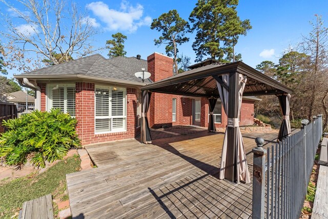 wooden terrace with a gazebo