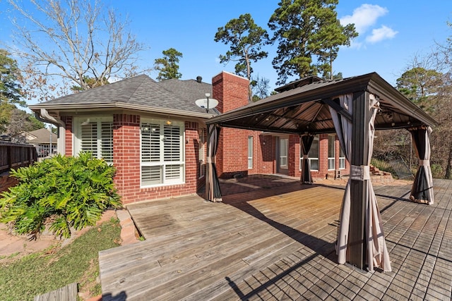 deck with fence and a gazebo