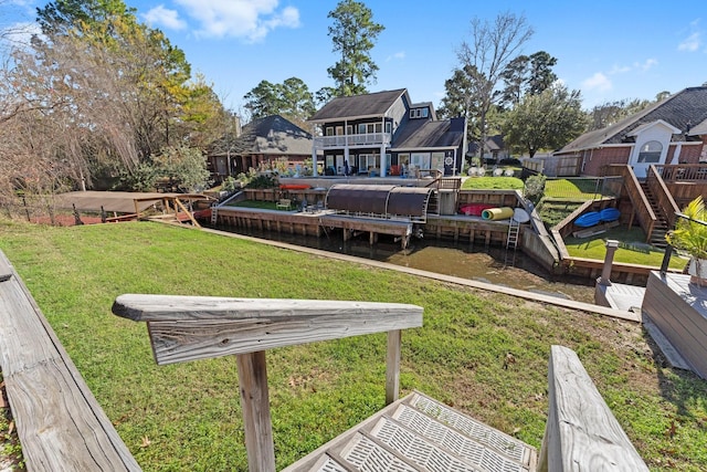 rear view of house featuring a yard