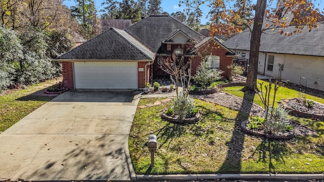 view of front of home with a front yard and a garage