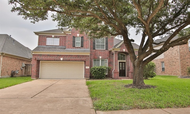 view of front facade with a garage and a front lawn