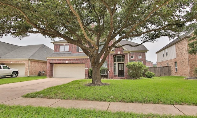 view of front of house featuring a garage and a front yard