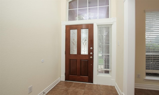 foyer featuring tile patterned flooring