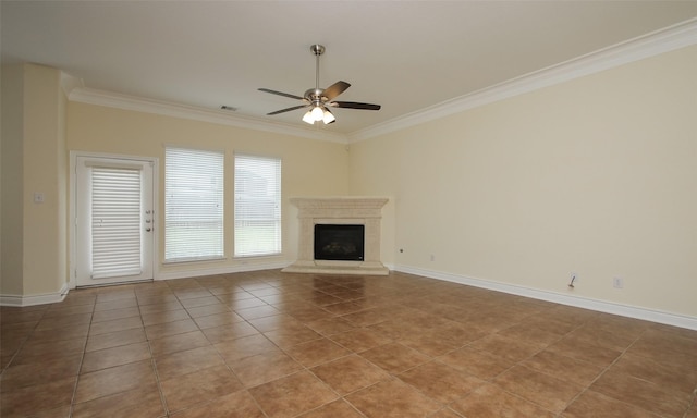 unfurnished living room featuring ceiling fan, light tile patterned floors, and ornamental molding