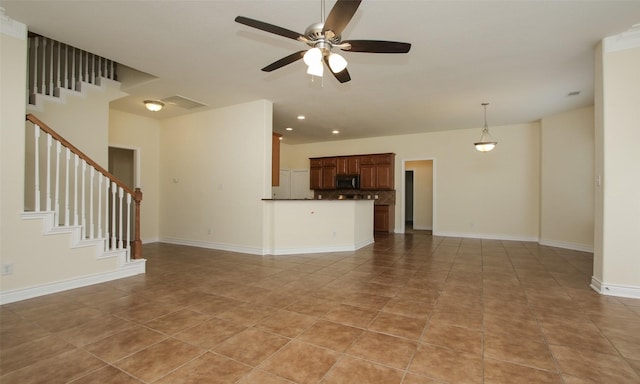 unfurnished living room featuring ceiling fan and light tile patterned floors