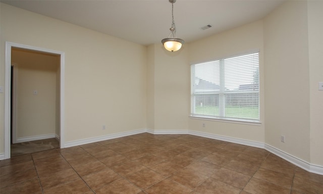 view of tiled spare room