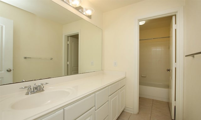 bathroom featuring tile patterned floors, vanity, and tiled shower / bath combo