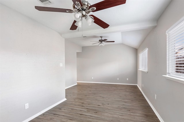 empty room featuring vaulted ceiling with beams, dark hardwood / wood-style floors, and ceiling fan