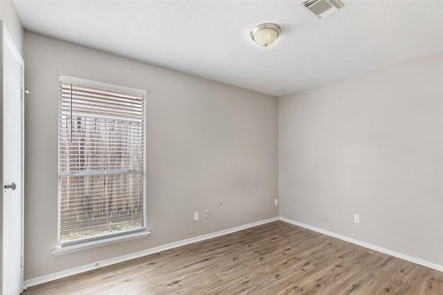 unfurnished room featuring light hardwood / wood-style flooring