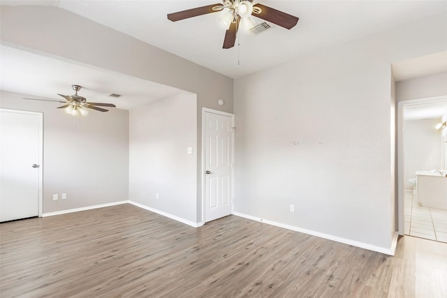 empty room with hardwood / wood-style flooring and ceiling fan