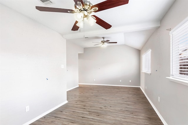 unfurnished room featuring lofted ceiling and dark hardwood / wood-style flooring