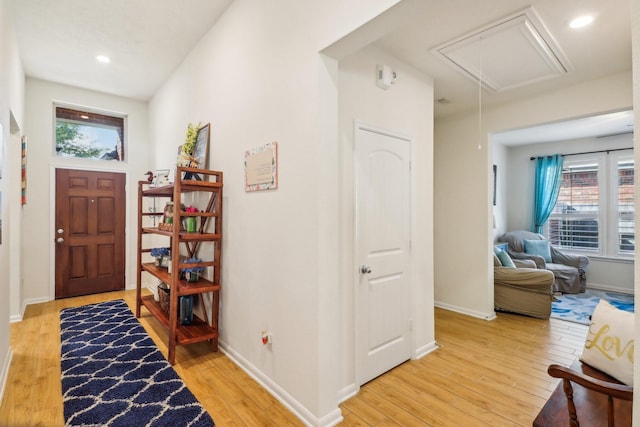 foyer entrance with light hardwood / wood-style flooring