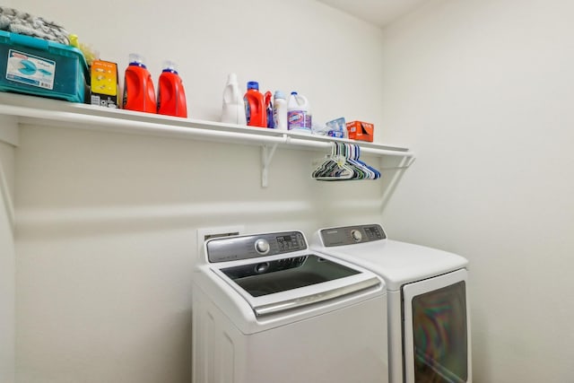 clothes washing area featuring washing machine and dryer