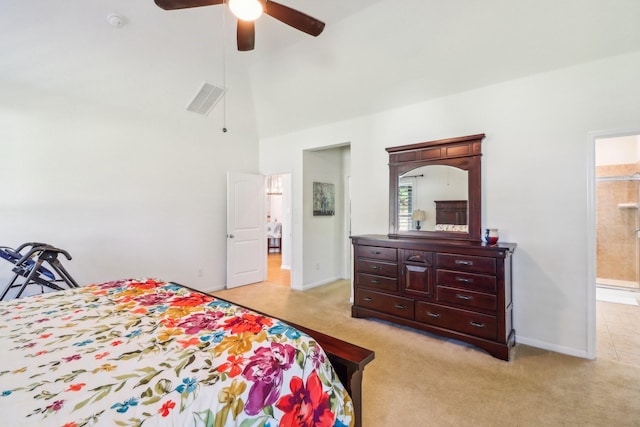 carpeted bedroom with ensuite bathroom, high vaulted ceiling, and ceiling fan