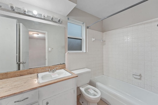 full bathroom with tiled shower / bath combo, toilet, and vanity