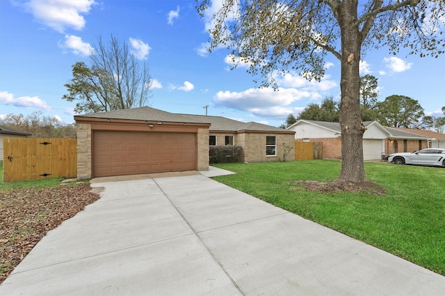 ranch-style home with a garage and a front yard