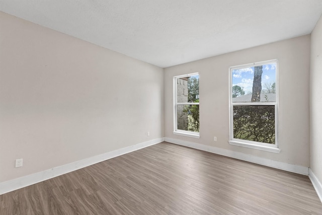 spare room featuring light hardwood / wood-style floors