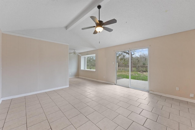 tiled spare room with ceiling fan, lofted ceiling with beams, and a textured ceiling